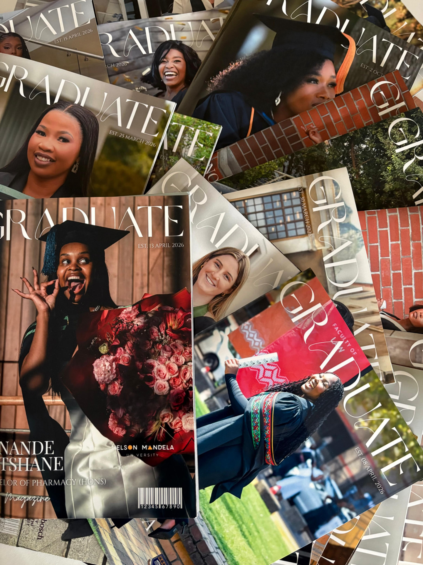A pile of personalised graduate magazines, including one made for Nande Tshane